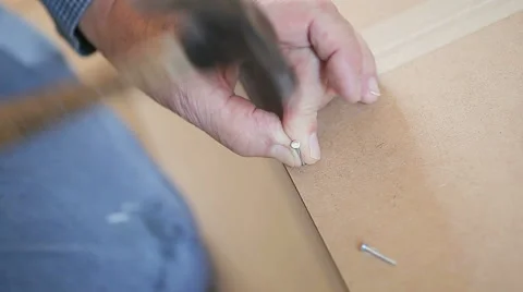 Hammering nails on DIY project Video stock 61496368
