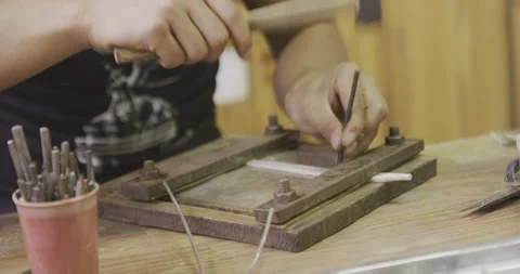 Hammering object with tools in cup Stock Footage 141362570