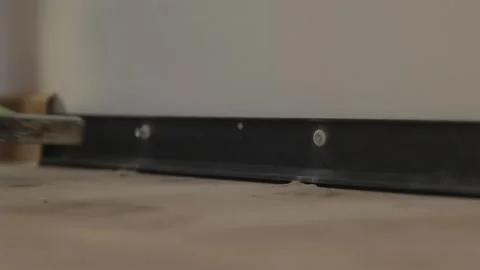Hammering plastic wall anchor plug into drilled wall hole Stock-Footage 346159808