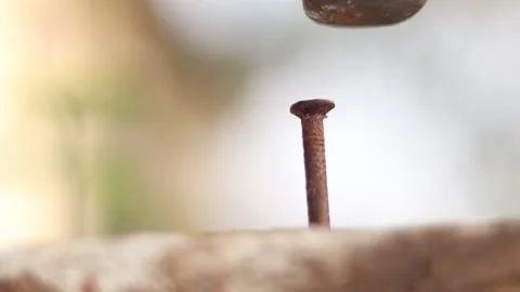 Hammering a rusty nail. Hammer hitting a nail Stock Footage 172084059