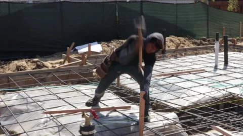 Hammering a stake in at construction site Stock-Footage 228794774