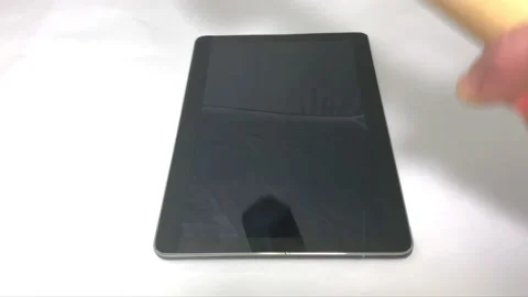 Hammering a Tablet from the side view Video stock 150265828