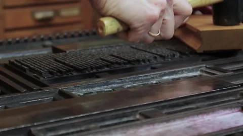 Hammering text bkock before printing Stock Footage 59186010