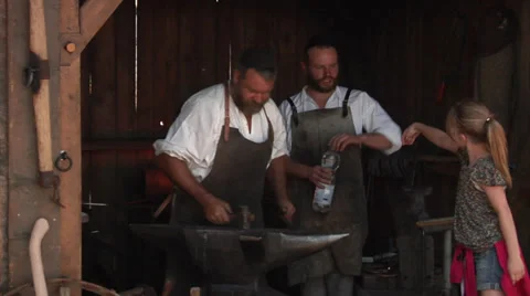 Hammerman, smith, blacksmith forges iron - Bozner Markt 2012 Stock Footage 31966312