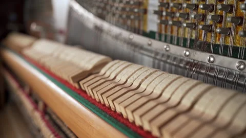 Hammers and strings inside piano, close up. Hammer in action, piano key is Stock Footage 268048835