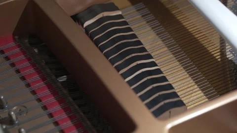 Hammers covered with soft felt knock on the piano strings. Stock Footage 164935905
