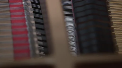 Hammers covered with soft felt knock on the piano strings Stock Footage 164935922