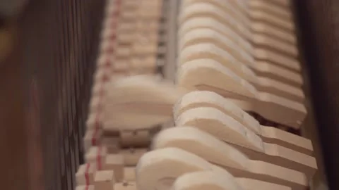 Hammers piano strike the string and create music, close up. Keyboard hammer Stock Footage 149044230