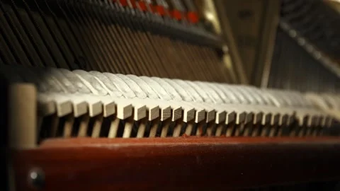 Hammers in a vintage piano hit the strings Stock Footage 232582091