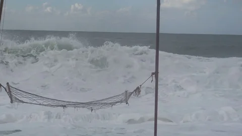 Hammock on the beach during a storm,big waves Stock-Footage 81965675