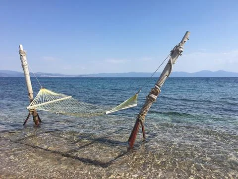Hammock at the beach in summer Stock Photos