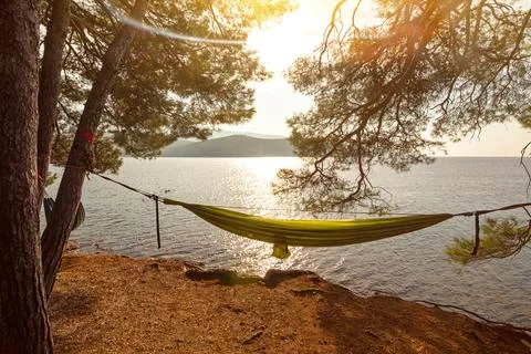 Hammock between pine trees in picturesque bay (Osor) on the island of Losinj Stock Photos