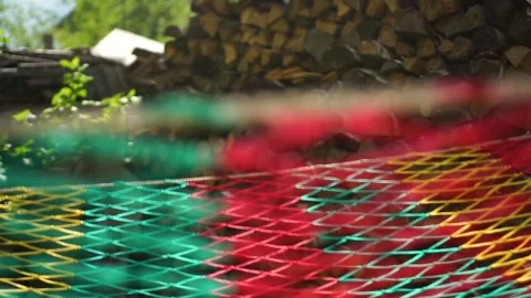 Hammock colorful net swinging back and forth slowly Vídeo Stock 243939274