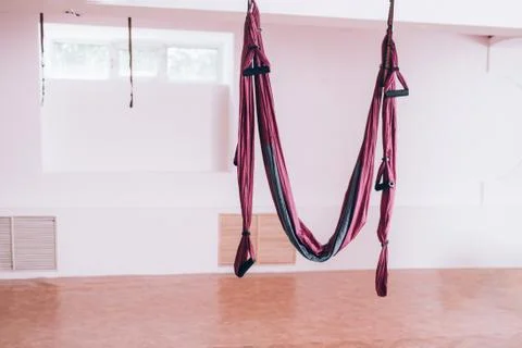 Hammock fixed to the ceiling, fly yoga equipment, yoga gym, health care Stock Photos
