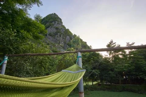 Hammock in front of a mountain in a backpacker hostel in the town of Phong Nha Stock Photos