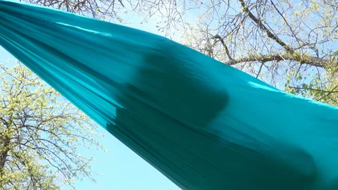 Hammock with a person inside Stock Footage 197015127