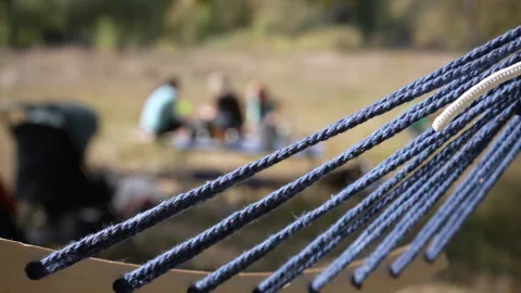Hammock ropes swing in the wind close-up. Stock Footage 252491164
