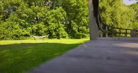 Hammock in the Sun on Grass [Shot in 8K] Stock Footage 204096007