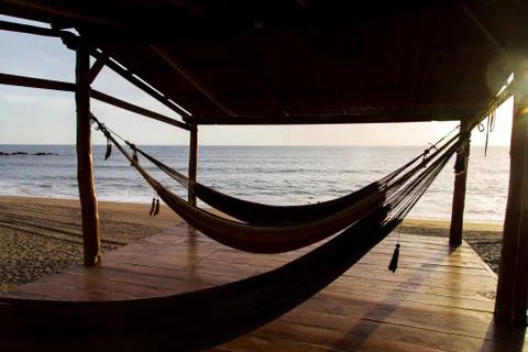 Hammock in sunshine beach Stock Photos