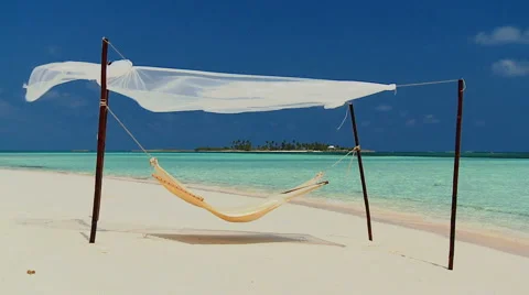 Hammock Swaying Over Tropical Beach Stock Footage