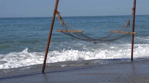 Hammock swinging on the beach Stock Footage 81997324