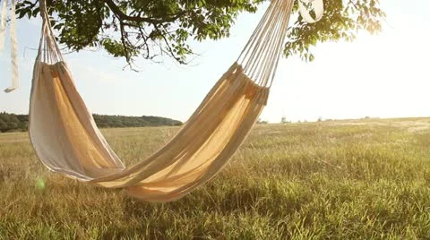 Hammock swinging on the wind at sunset Stock Footage 11602745
