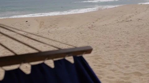 Hammock view on beach and sea in the shade of palmtrees on tropical beach 스톡 동영상 61736302