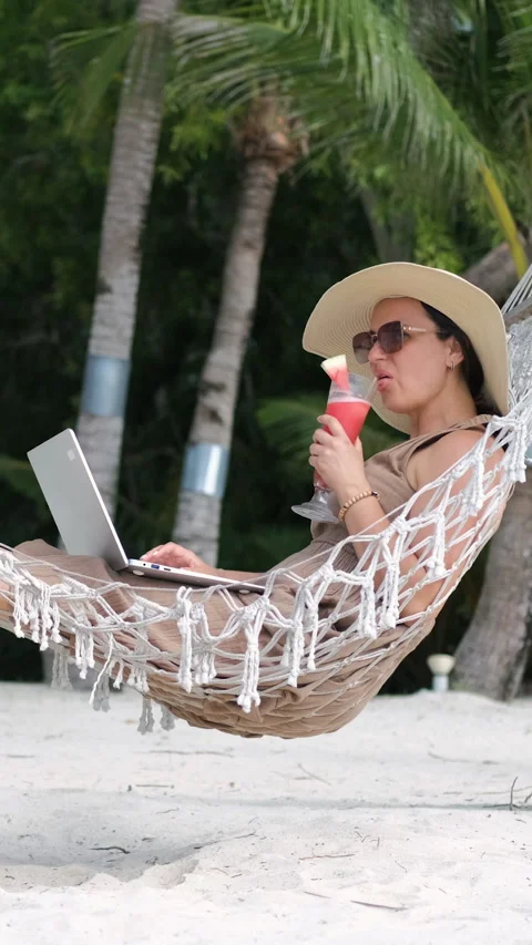 Hammock work with sea view and fruit shake Stock Footage 315294909