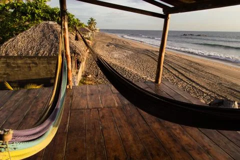 Hammocks in beach Stock Photos