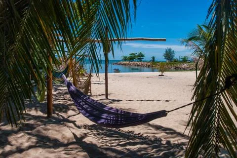 Hammocks on the beach in shade Stock Photos