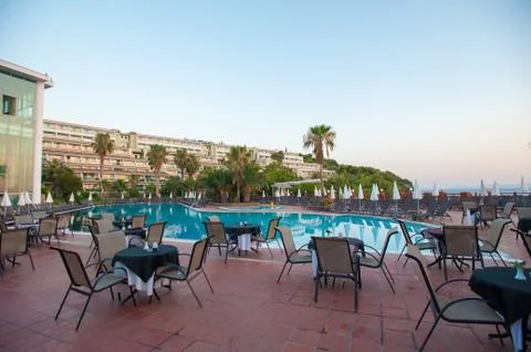 Hammocks with umbrellas by the pool for guests Foto stock