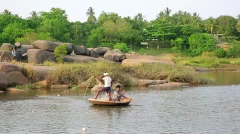 HAMPI, KARNATAKA, INDIA - APRIL 2013: Men fishing in mountain river Stock Footage 23330230