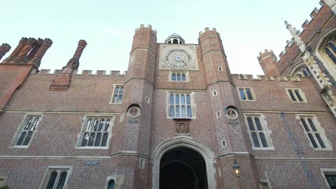 Hampton Court Palace courtyard clock. Tilt down. 4K Stock Footage