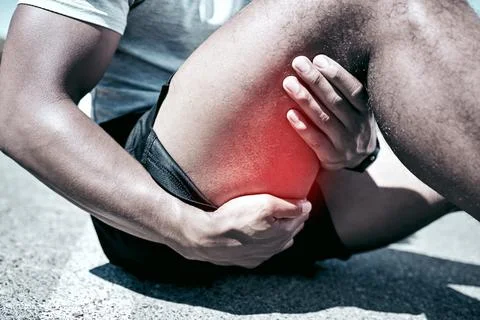 Hamstring pain, hands and person with injury on road after training accident and Stock Photos