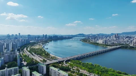 The Han River, Railway Bridge and Olympic Bridge from Jamsil in Seoul Stock Footage 346466969