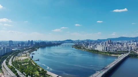 The Han River, Railway Bridge and Olympic Bridge from Jamsil in Seoul Stock Footage 346467111