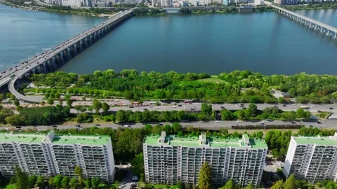 The Han River, Railway Bridge and Olympic Bridge from Jamsil in Seoul Stock Footage 346468550