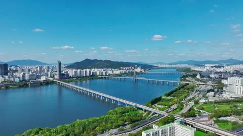 The Han River, Railway Bridge and Olympic Bridge from Jamsil in Seoul Stock Footage 346469238