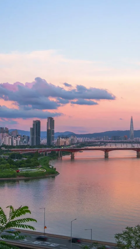 Han River Sunset Timelapse With Expressway Traffic and Lotte Tower Stock Footage 341549239