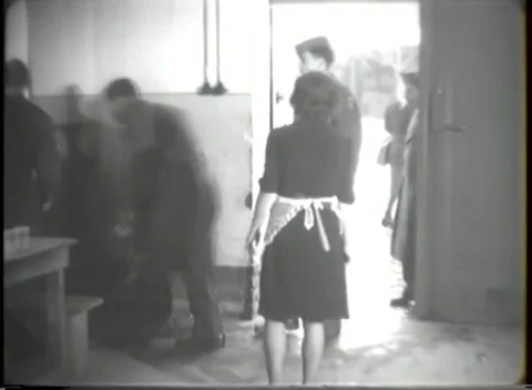 HANAU, GERMANY - 1947: Gift help - Adults help children carry holiday gifts Stock Footage 344488338