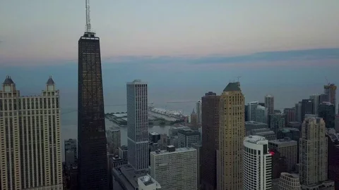 Hancock Building with Navy Pier in Background - 4k Aerial Video stock 104093458