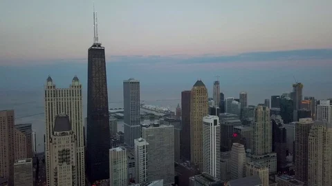 Hancock Building with Navy Pier in Background - 4k Aerial Video stock 104093486