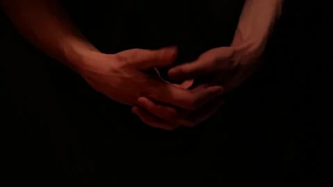 Hand 3Close up man hands waiting on dark background.  Stock Footage 142138953