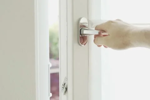 Hand is about to open window Stock Photos