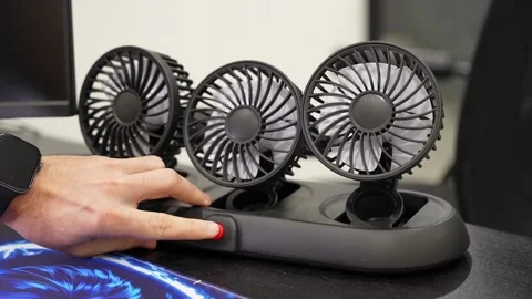 Hand Activating Triple Desktop Cooling Fans Stock Footage 341717670