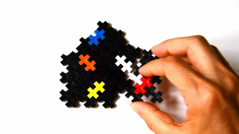 Hand adding and completing a puzzle house Stock-Footage 111008541