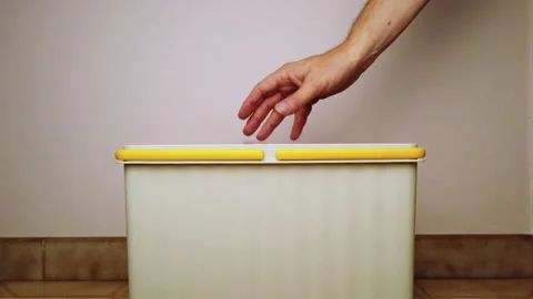 Hand is adding empty plastic to reclyng bin Stock Footage 158829608