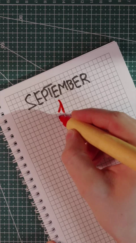 Hand adding red number 1 to September handwritten text Stock Footage 341246081