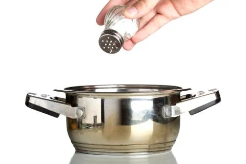 Hand adding salt Stock Photos