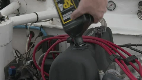 Hand adds engine oil into valve cover of Datsun, 4K. Stock Footage 146184239